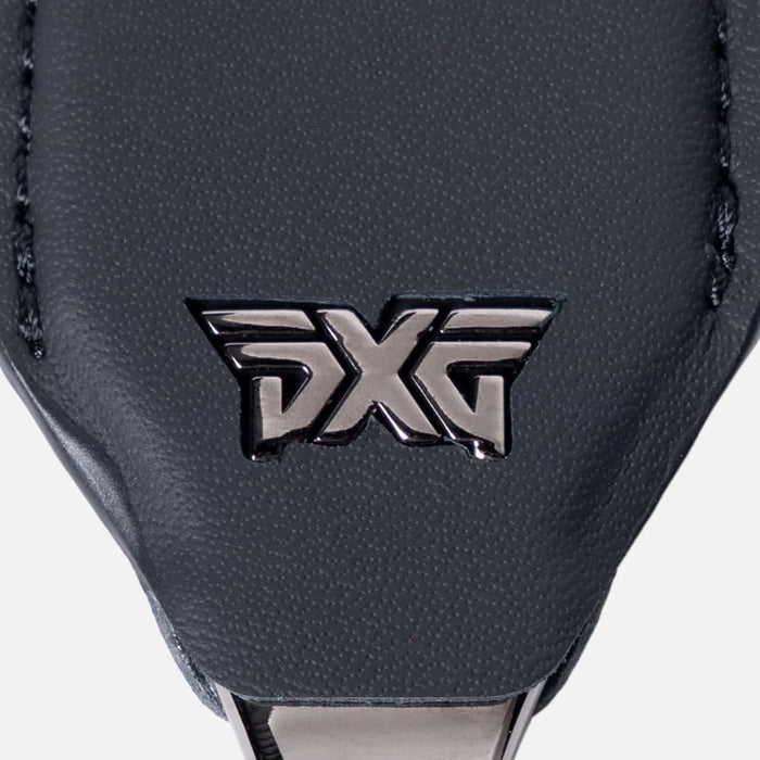 PXG black leather darkness divot golf tool on a white background