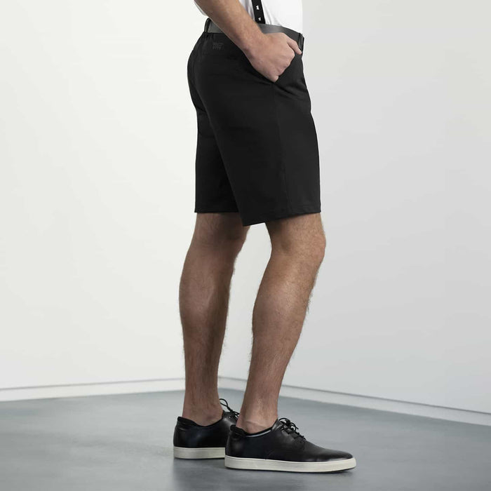 PXG men's black essential golf shorts on a white background