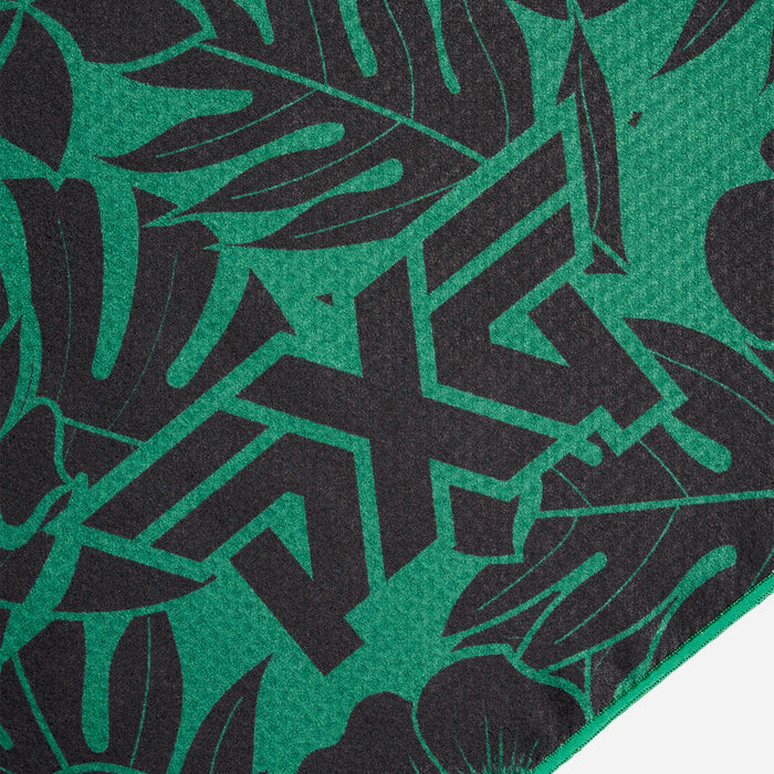 PXG black and green aloha players towel with black flowers and leaves on a white background