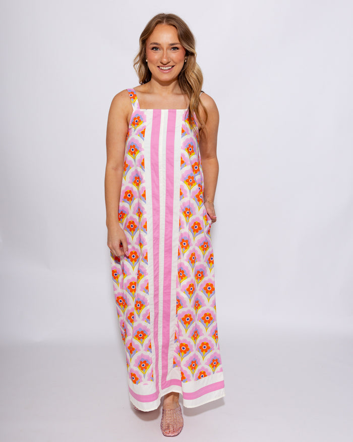 Pink and yellow floral sleeveless midi dress with scalloped detail and contrast border panel, 100% cotton with pockets at Gaudie & Co