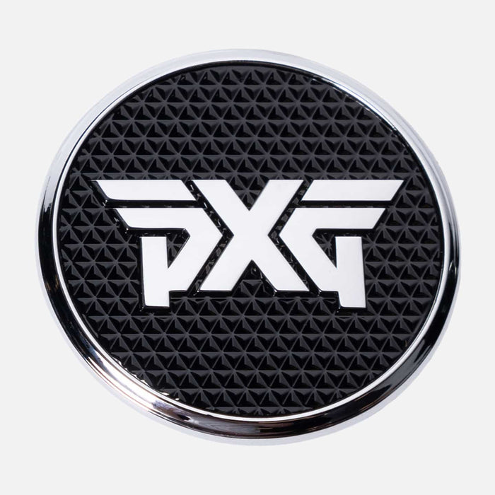 PXG chrome golf ball marker with a black leather encasing and a white pxg logo on a white background