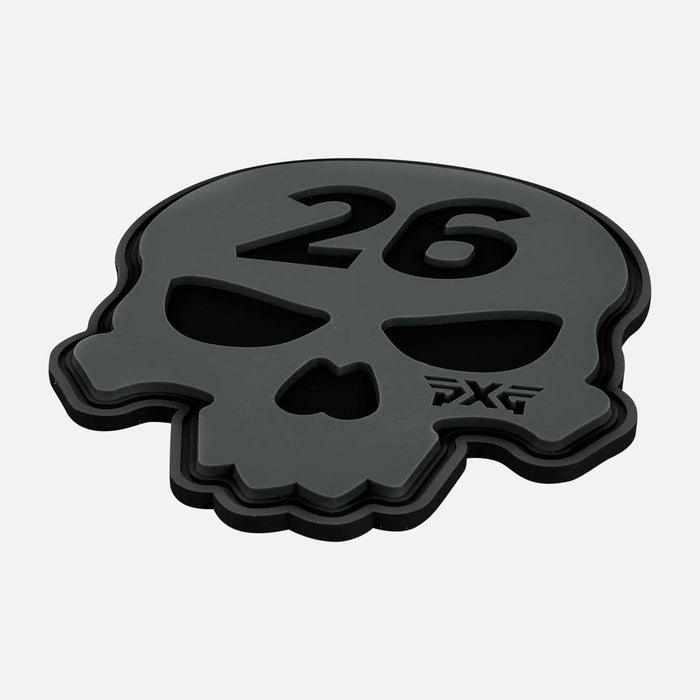 PXG white candle that has a black candle holder with pxg as a logo on the side on a white background