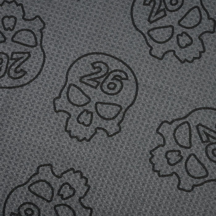 PXG dark gray darkness repeat player's golf towel with repeating skulls on a white background