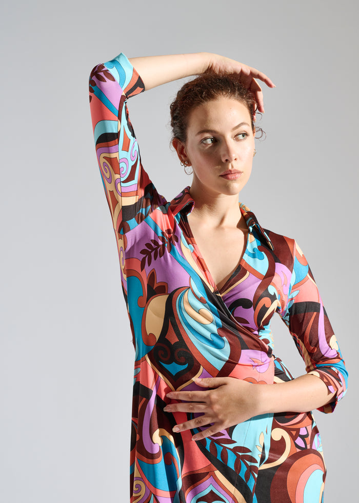 Woman dons multicolor wrap dress