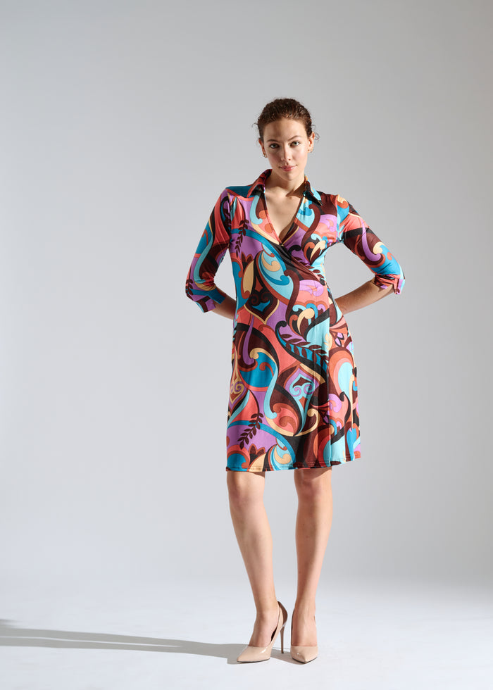 Woman models abstract print wrap dress