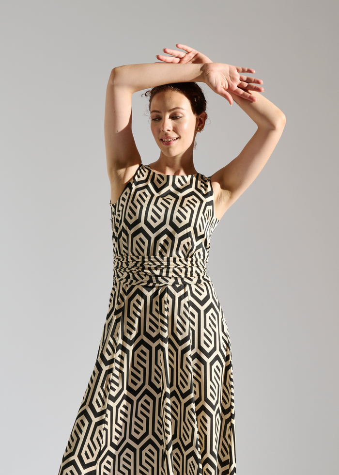 Close up of Chic sleeveless Calvin maxi dress with modern pattern.