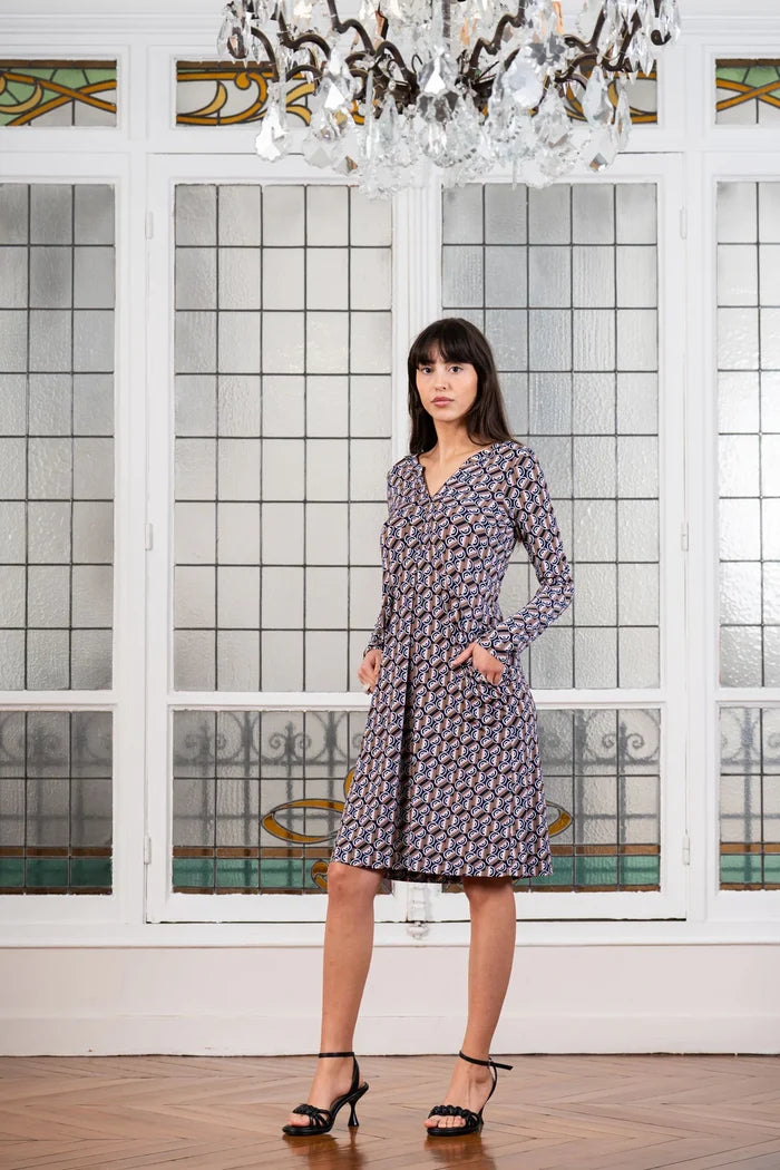 Model wearing split neckline dress