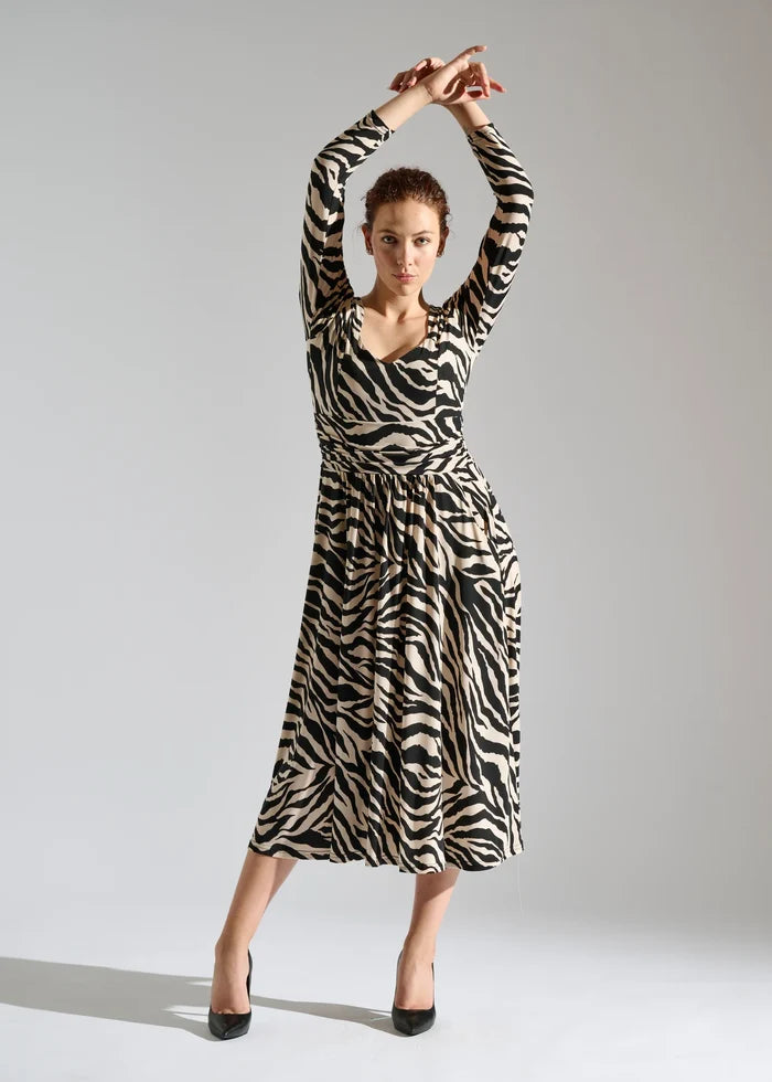 Woman wearing long-sleeve dress with pockets