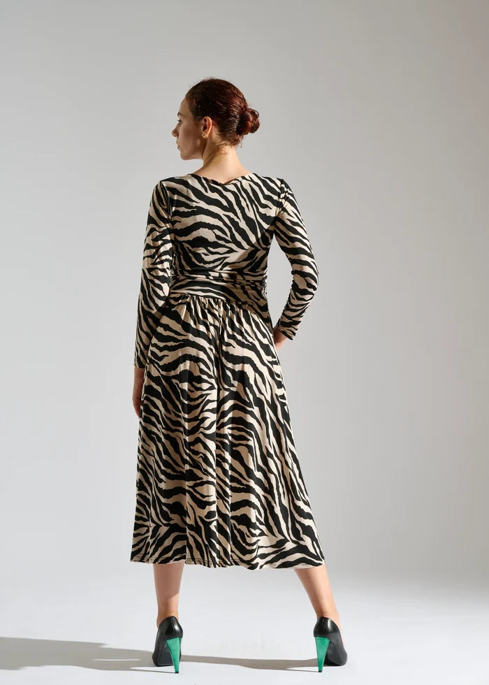 Woman models zebra print dress