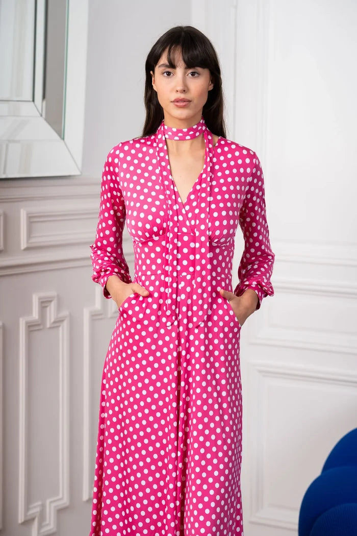 Model wears an Elegance Miss V-neck polka dot dress