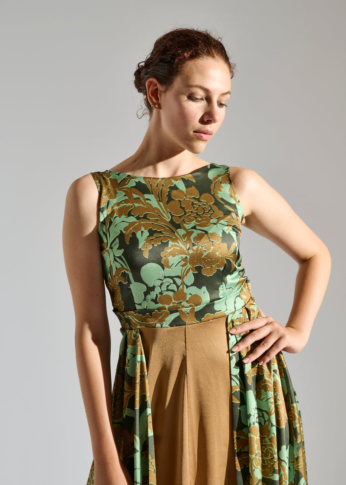 Close up of Gio black sleeveless maxi dress with brown and green floral pattern.