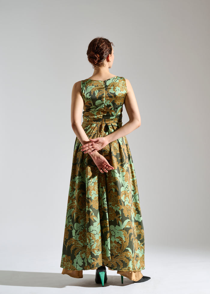 Back view of Gio black sleeveless maxi dress with brown and green floral pattern.