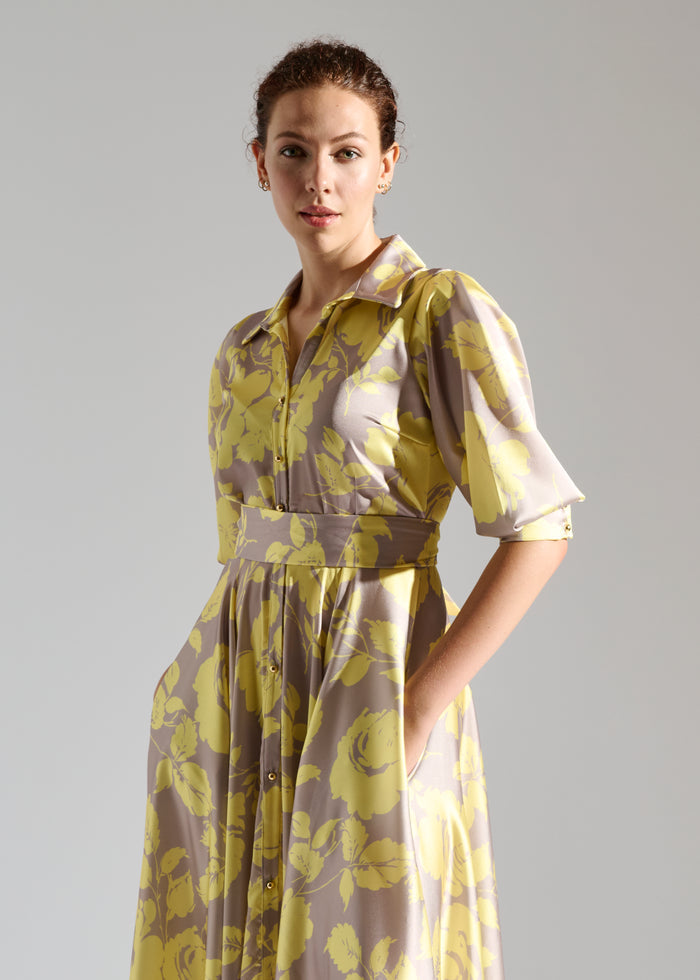 Close up of Kayz pastel maxi dress with white floral pattern.