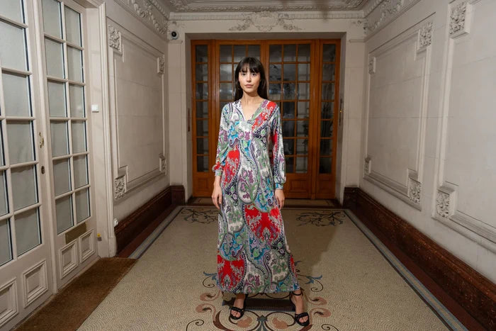 Woman wears flowy boho maxi dress with sleeves