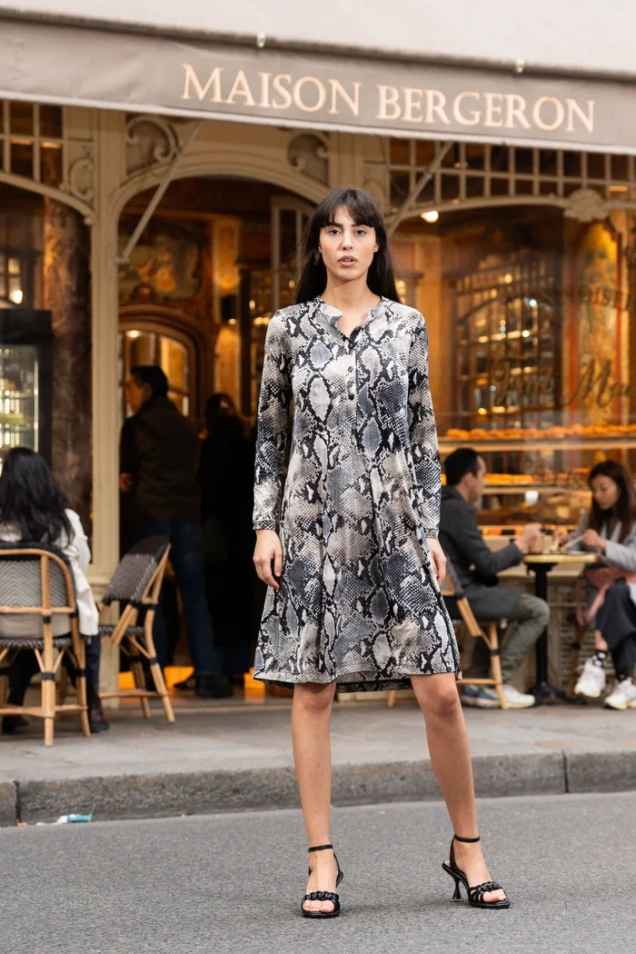 Model wearing snakeskin pattern dress in Paris