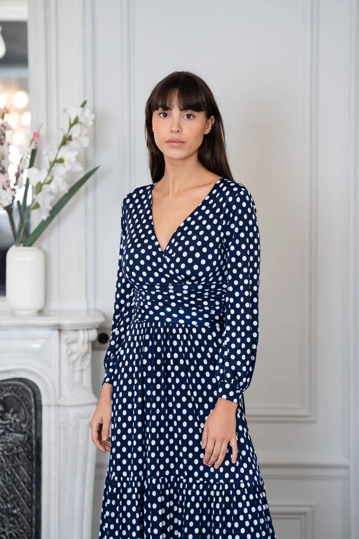 Model wears an Elegance Miss tiered skirt dress in a Paris apartment