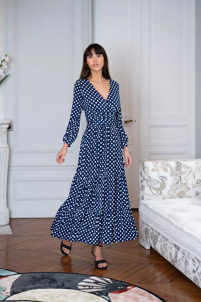 Woman wears long sleeve polka dot dress
