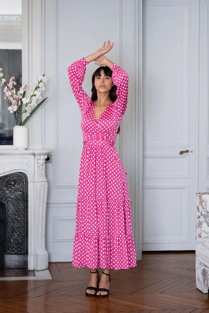 Woman wears an Elegance Miss wrap polka dot dress