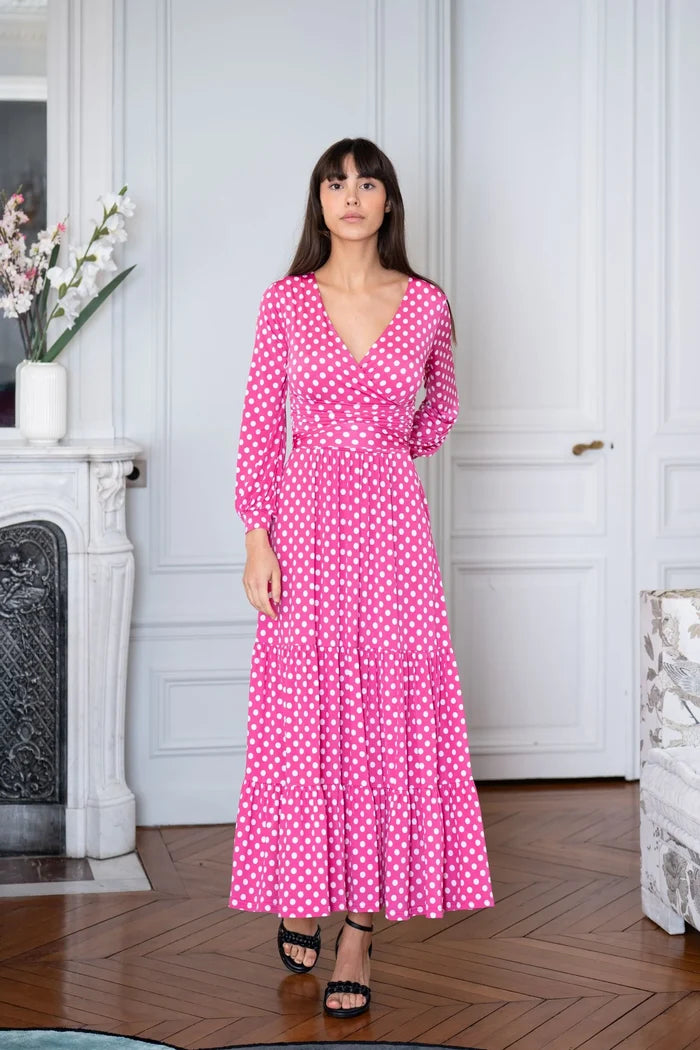 Model dons pink polka dot maxi dress in a Paris apartment