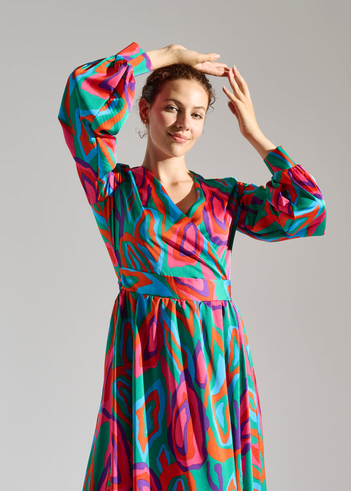 Second Close up of Lovei abstract-patterned green, red, and purple maxi dress.
