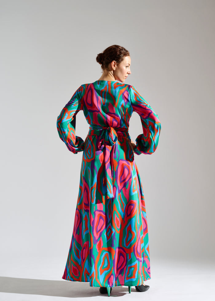 Back view of Lovei abstract-patterned green, red, and purple maxi dress.