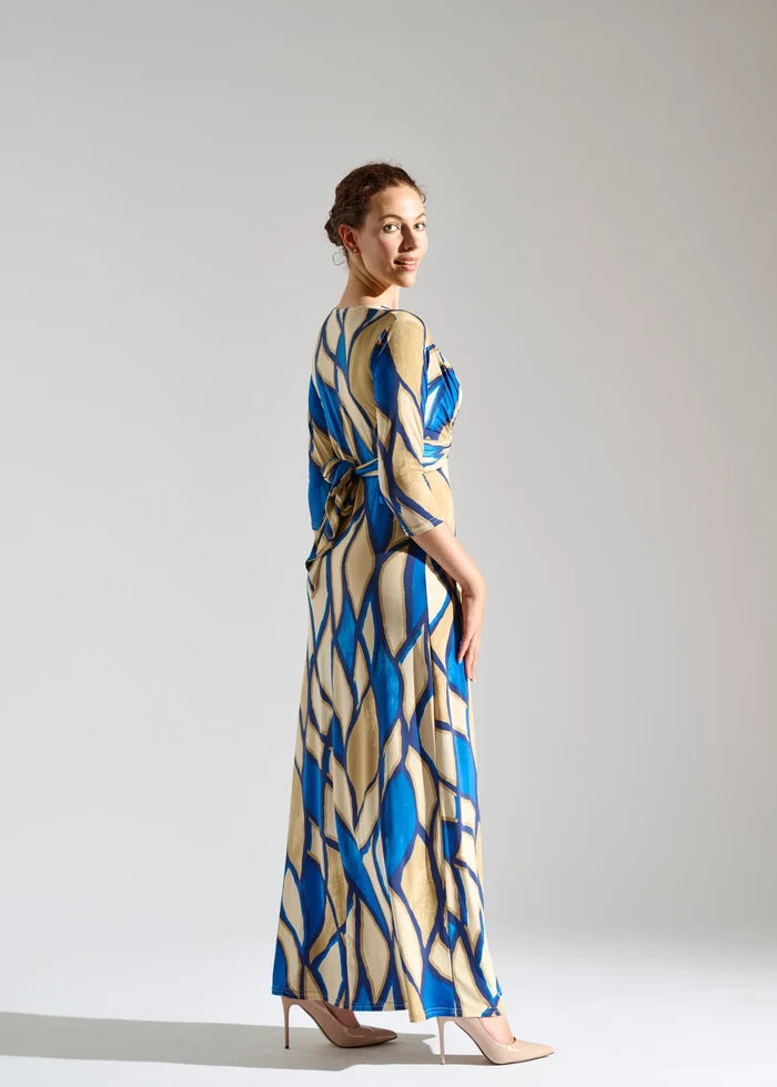 Woman models V-neck dress with 3/4 sleeves