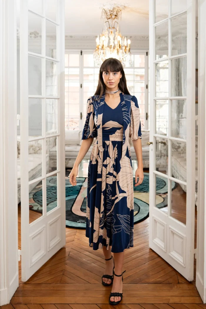 Woman wearing blue and beige Elegance Miss dress
