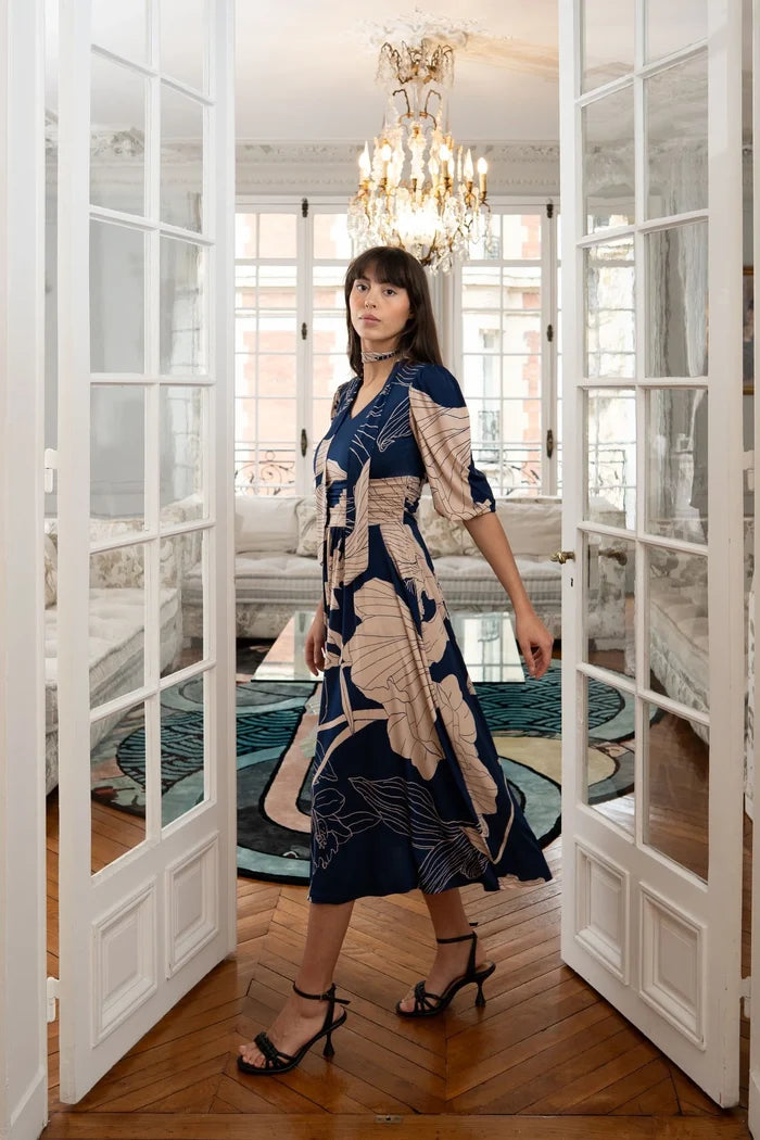 Woman dons an Elegance Miss midi dress with a neck scarf