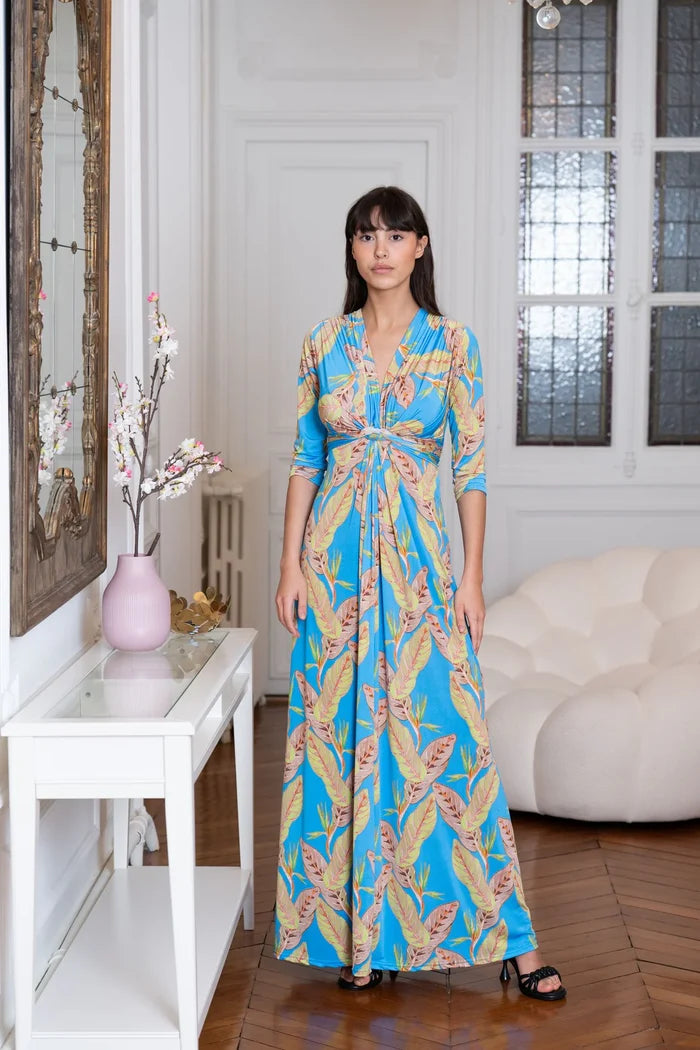 Model wears a formal tropical dress