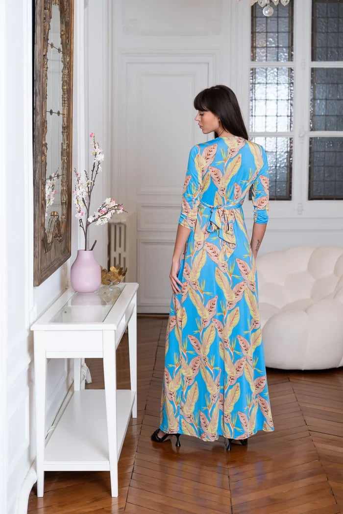 Model wears Elegance Miss formal tropical dress