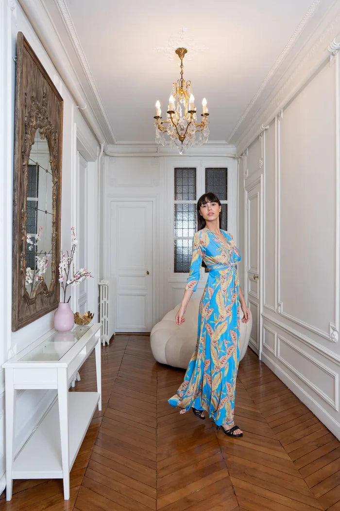 Model dons tropical print maxi dress