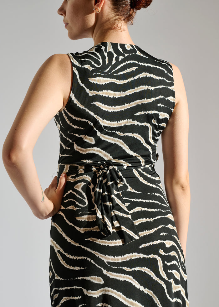 Close up of Milou black sleeveless maxi dress with animal-like pattern.