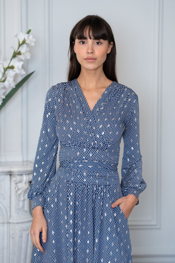 Model wears an Elegance Miss geometric print dress
