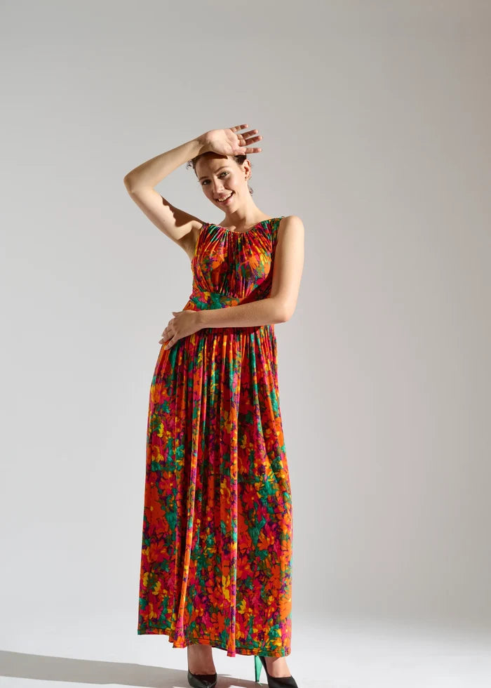 Woman wearing sleeveless floral maxi dress