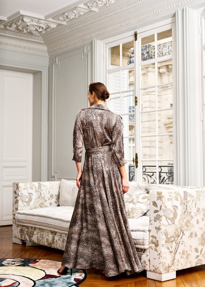 Woman models leopard print maxi dress in Parisian apartment woman-leopard-print-maxi-dress-in-parisian-apartment
