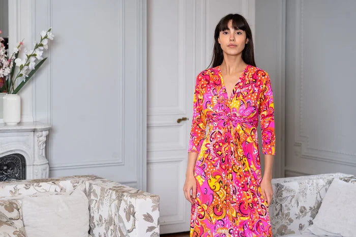 Model wearing women’s pink and orange dress