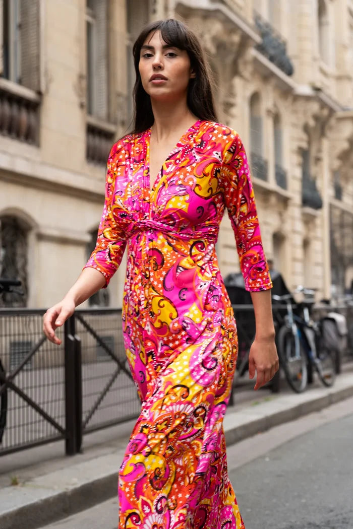 Woman wears long paisley dress in Paris
