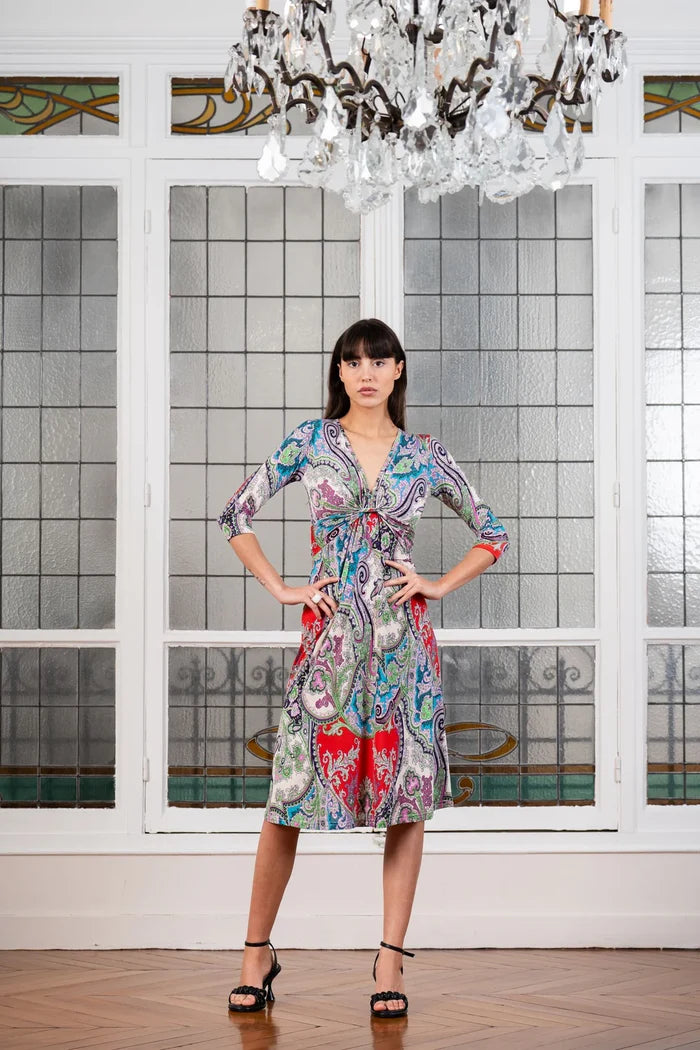 Model poses in an Elegance Miss midi twist front dress