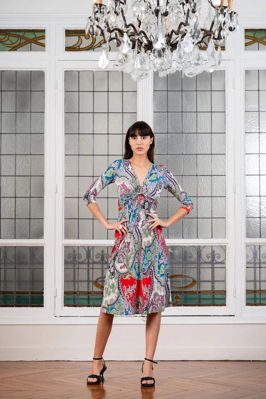 Model poses in an Elegance Miss midi twist front dress