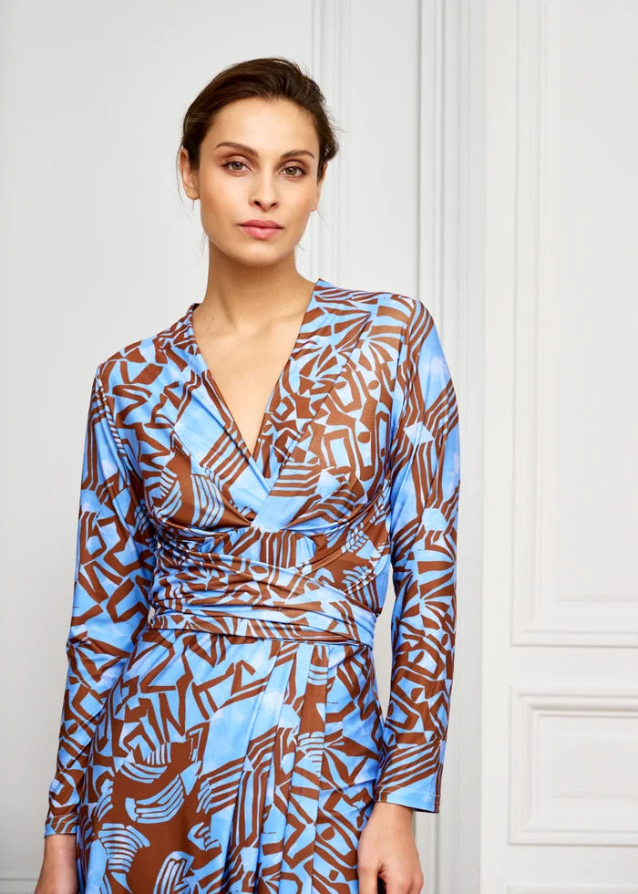 Woman models knee-length V-neck dress
