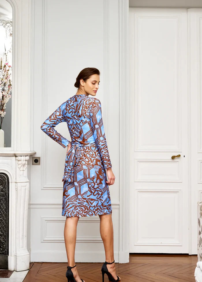 Woman wears knee-length V-neck dress