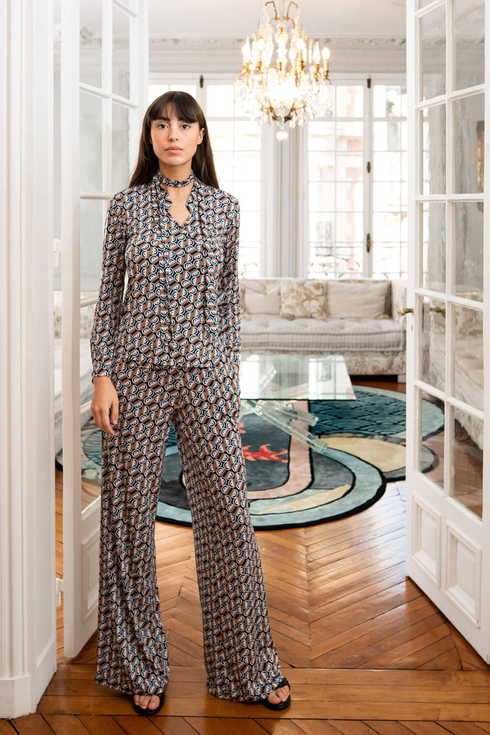 Model poses in Elegance Miss women’s top and pants set