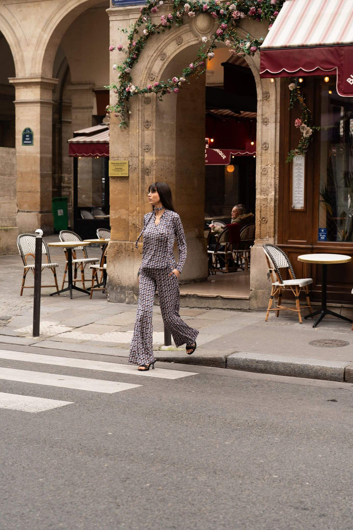 Model wears a two-piece print set in Paris street