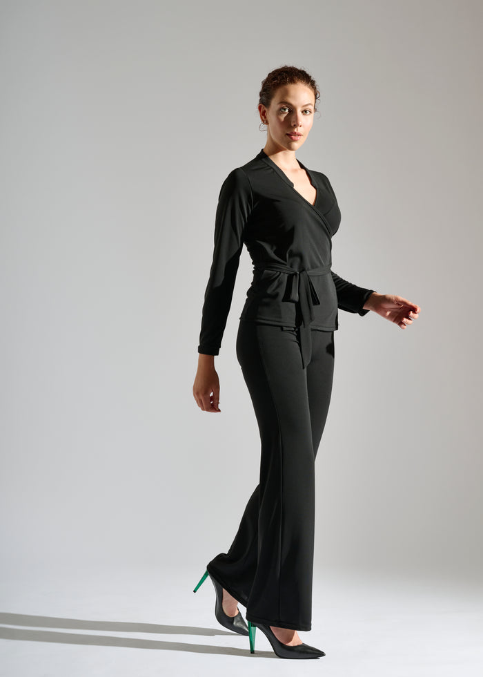 Woman dons black two-piece pants set