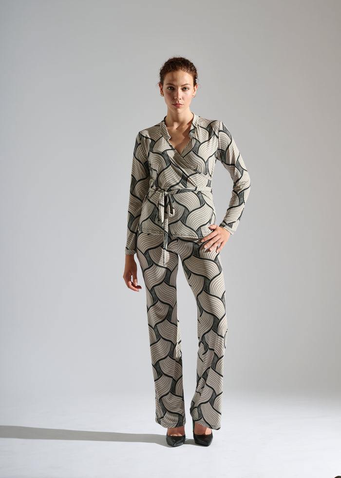 model wears an Elegance Miss black and white two-piece set