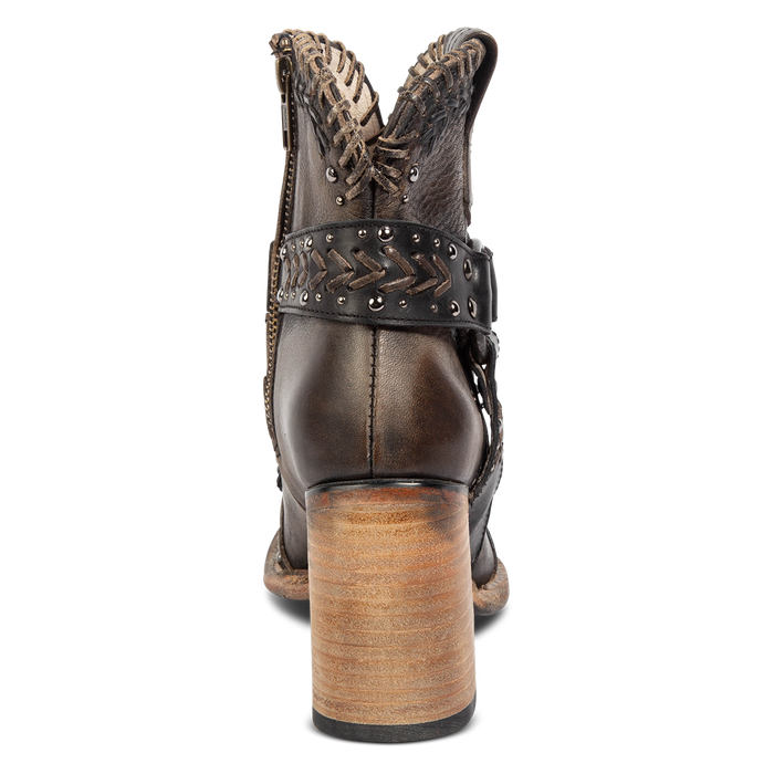 Back view showing a wood stacked heel and detailed heel strap on FREEBIRD women's Jetson black bootie