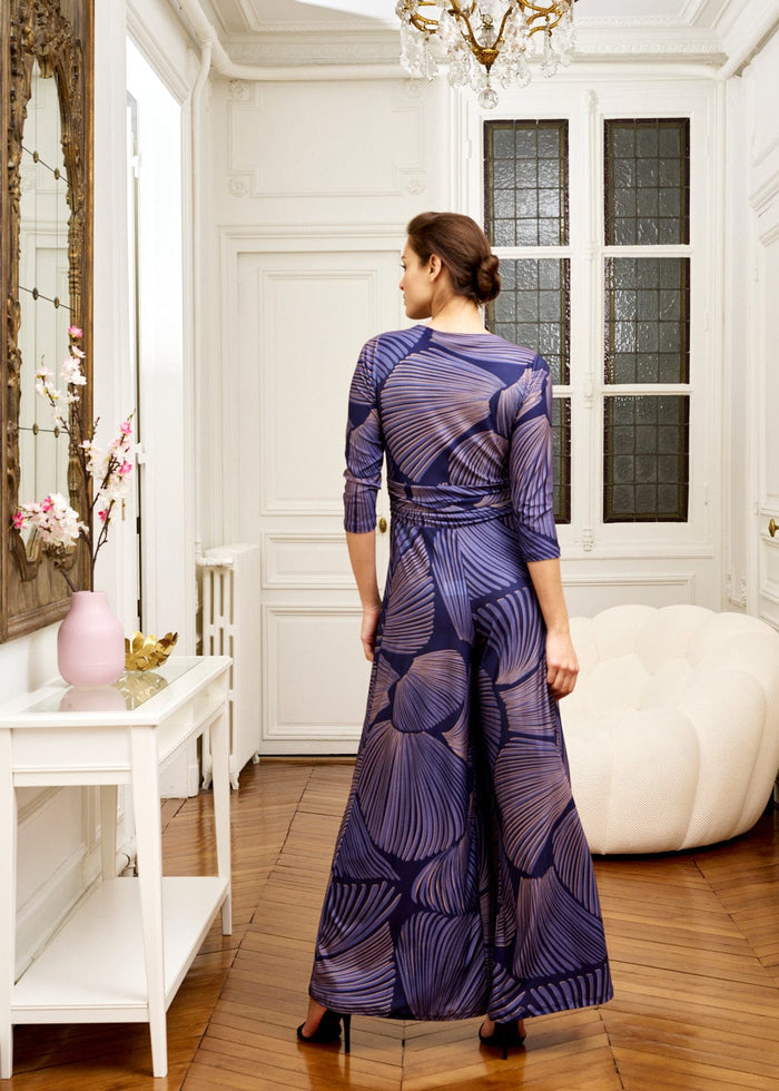 woman models chic indigo jumpsuit