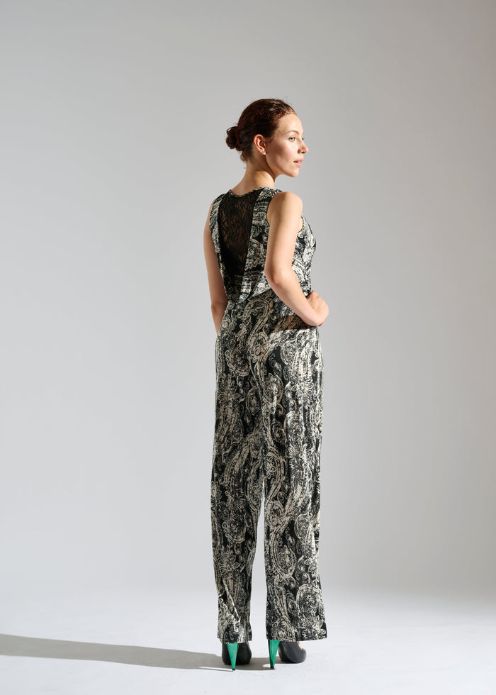 Back view of Elevran black sleeveless jumpsuit with elegant gold pattern.