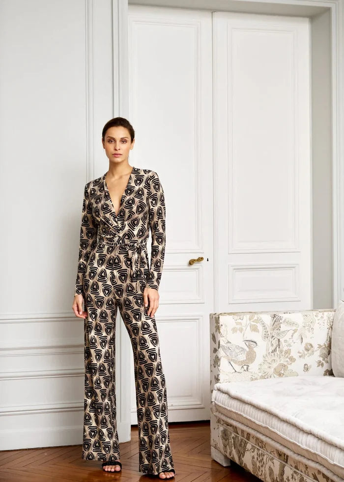 Woman models deep V-neck jumpsuit