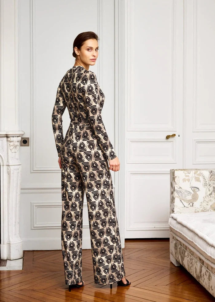 Woman models geometric jumpsuit